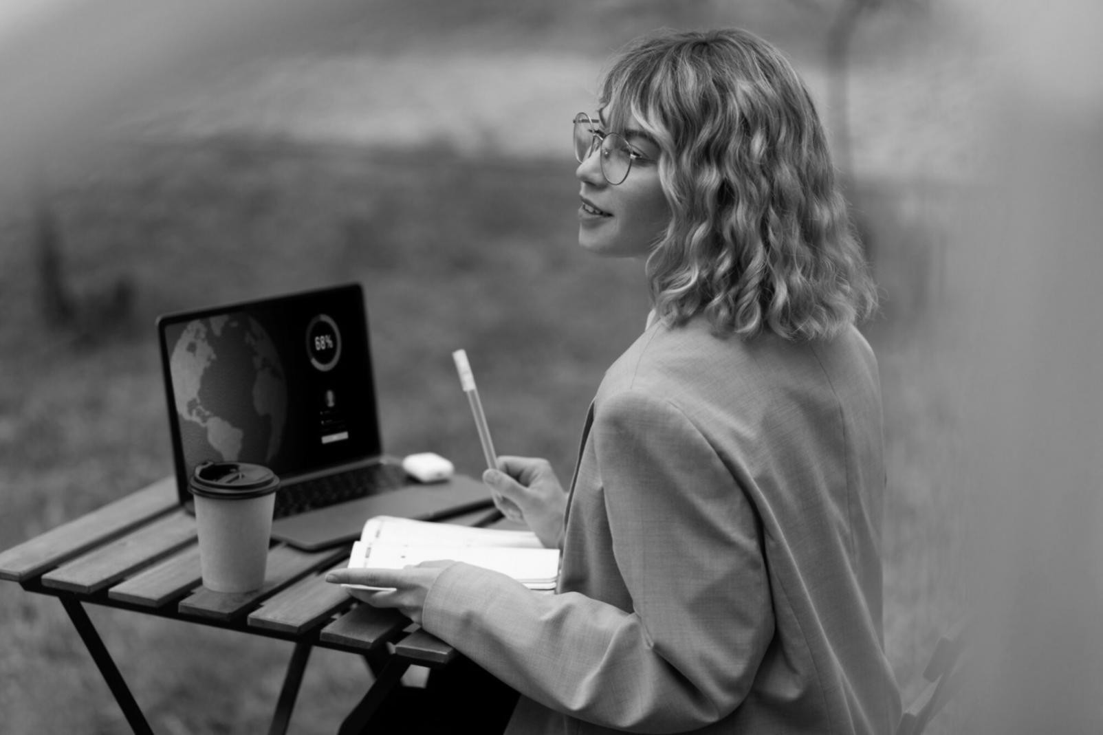 Person reviewing financial documents and calculations at desk