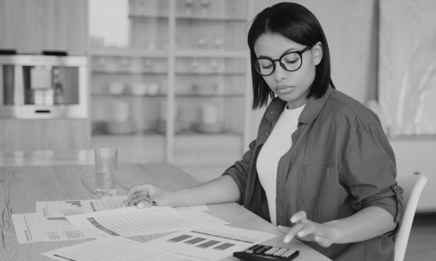 Professional reviewing financial statements and net worth calculations